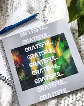 Load image into Gallery viewer, Spiral notebook with colorful artwork on cover